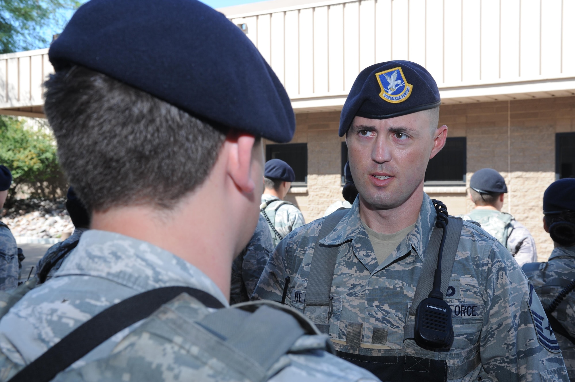U.S. Air Force Master Sgt. David Beasley, 355th Security Forces Squadron trainer, inspects an Airman’s dress and appearance during a guard mount formation at Davis-Monthan Air Force Base, Ariz., Sept. 29, 2016. The 355th SFS consists of over 300 military and civilian personnel. (U.S. Air Force photo by Airman 1st Class Mya M. Crosby)