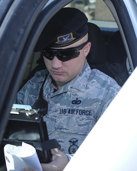 U.S. Air Force Staff Sgt. Bradley, 355th Security Forces Squadron member, writes a ticket at Davis-Monthan Air Force Base, Ariz., Sept. 29, 2016. The 355th SFS consists of over 300 military and civilian personnel. (U.S. Air Force photo by Airman 1st Class Mya M. Crosby)