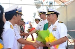 160928-N-WJ640-075 DA NANG, Vietnam (Sept. 29, 2016) Capt. H. B. Le, commodore, Destroyer Squadron 7, shakes hands with members of the Vietnam People's navy during a welcome ceremony in Da Nang, Vietnam Sept. 29 in support of Naval Engagement Activity (NEA) Vietnam 2016. In its seventh year, NEA Vietnam is designed to foster mutual understanding, build confidence in the maritime domain and strengthen relationships between the U.S. Navy, Vietnam People's navy and the local community. (U.S. Navy photo by Mass Communication Specialist 3rd Class Madailein Abbott)