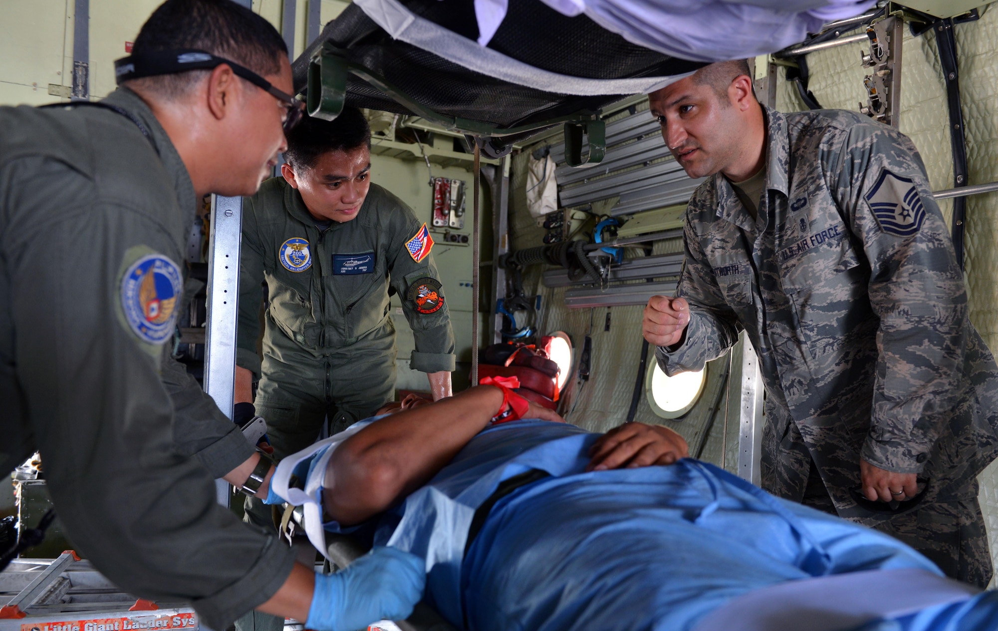 U.S. Air Force Master Sgt. Nick Wentworth, independent medical duty technician, assigned to the 342nd Training Squadron, Lackland Air Force Base, Texas, exchanges lessons learned with his Philippine Air Force counterparts in the midst of a mass casualty response capstone event during the current iteration of a rotational Air Contingent at Brigadier General Benito N Ebuen Air Base, Philippines, Sept. 29, 2016. During the mass casualty subject matter expert exchange, civilian and military disaster response experts from the two countries met together to exchange ideas and best practices. The Air Contingent is helping build the capacity of the Philippine Air Force and increases joint training, promotes interoperability and provides greater and more transparent air and maritime situational awareness to ensure safety for military and civilian activities in international waters and airspace. Its missions include air and maritime domain awareness, personnel recovery, combating piracy, and assuring access to the air and maritime domains in accordance with international law. (U.S. Air Force photo by Capt. Mark Lazane)