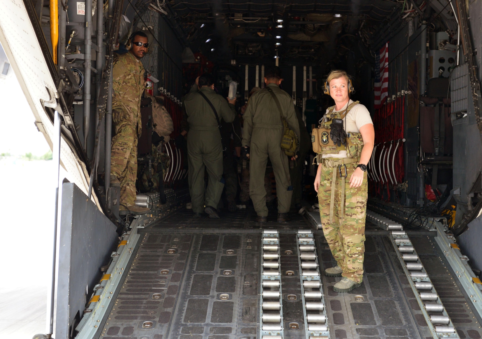 U.S. Air Force crew members from Kadena Air Base, Japan, await passengers during an engines running onload drill as part of a mass casualty response exercise during the current iteration of a rotational Air Contingent at Brigadier General Benito N Ebuen Air Base, Philippines, Sept. 29, 2016. Two C-130 Hercules aircraft and crews from 374th Airlift Wing, Yokota Air Base, Japan, the 36th Contingency Response Group from Andersen Air Force Base, Guam, and other units from across U.S. Pacific Command conducted bilateral training missions and subject matter expert exchanges alongside their Philippine Air Force counterparts.  (U.S. Air Force photo by Capt. Mark Lazane)