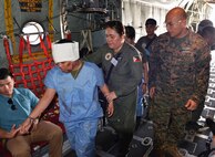 U.S. Navy Chief Petty Officer Mark Gaskins, a hospital corpsman (right), observes proper patient loading procedures during a civilian and military disaster response exercise as part of the current iteration of a rotational Air Contingent at Brigadier General Benito N Ebuen Air Base, Philippines Sept. 29, 2016. Two C-130 Hercules aircraft and crews from the 374th Airlift Wing, Yokota Air Base, Japan, the 36th Contingency Response Group from Andersen Air Force Base, Guam, and other units from across U.S. Pacific Command conducted bilateral training missions and subject matter expert exchanges alongside their Philippine Air Force counterparts. The Air Contingent is helping build the capacity of the Philippine Air Force and increases joint training, promotes interoperability and provides greater and more transparent air and maritime situational awareness to ensure safety for military and civilian activities in international waters and airspace. Its missions include air and maritime domain awareness, personnel recovery, combating piracy, and assuring access to the air and maritime domains in accordance with international law. (U.S. Air Force photo by Capt. Mark Lazane)