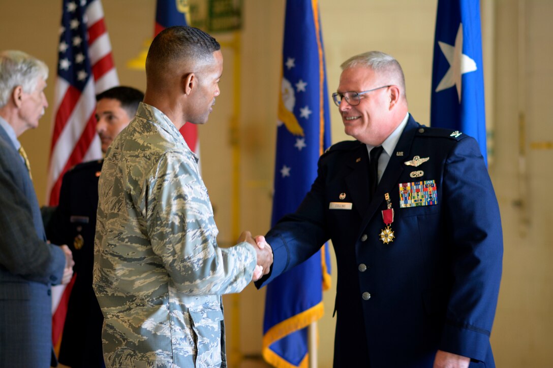 U.S. Air Force Director of Staff, Joint Force Headquarters, North Carolina Air National Guard (NCANG) Brig. Gen. Clarence Ervin, says farewell with gratitude to Col. Marshall C. Collins for his years of dedication and leadership to the 145th Airlift Wing following a change of command ceremony held at the NCANG Base, Charlotte Douglas International Airport, Oct. 1, 2016. (U.S. Air National Guard photo by Staff Sgt. Laura J. Montgomery)