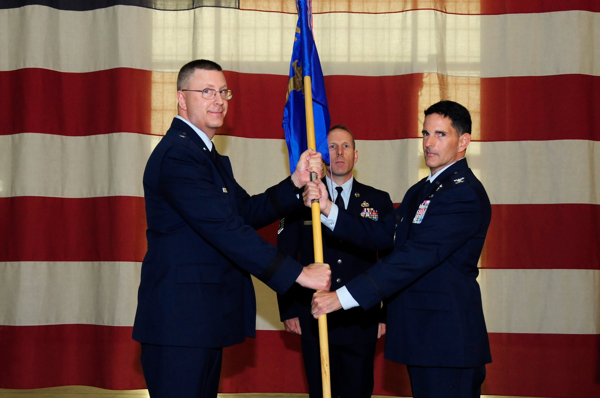 U.S. Air Force Col. Michael Troy Gerock (right) accepts command of the 145th Airlift Wing from Brig. Gen. Roger E. Williams Jr. (left), Assistant Adjutant General for Air, North Carolina Air National Guard (NCANG), during a change of command ceremony held at the NCANG Base, Charlotte Douglas International Airport, Oct. 1, 2016. Gerock is a C-130 Hercules aircraft pilot and has been a member of the NCANG for 23 years. (U.S. Air National Guard photo by Staff. Sgt. Julianne M. Showalter)