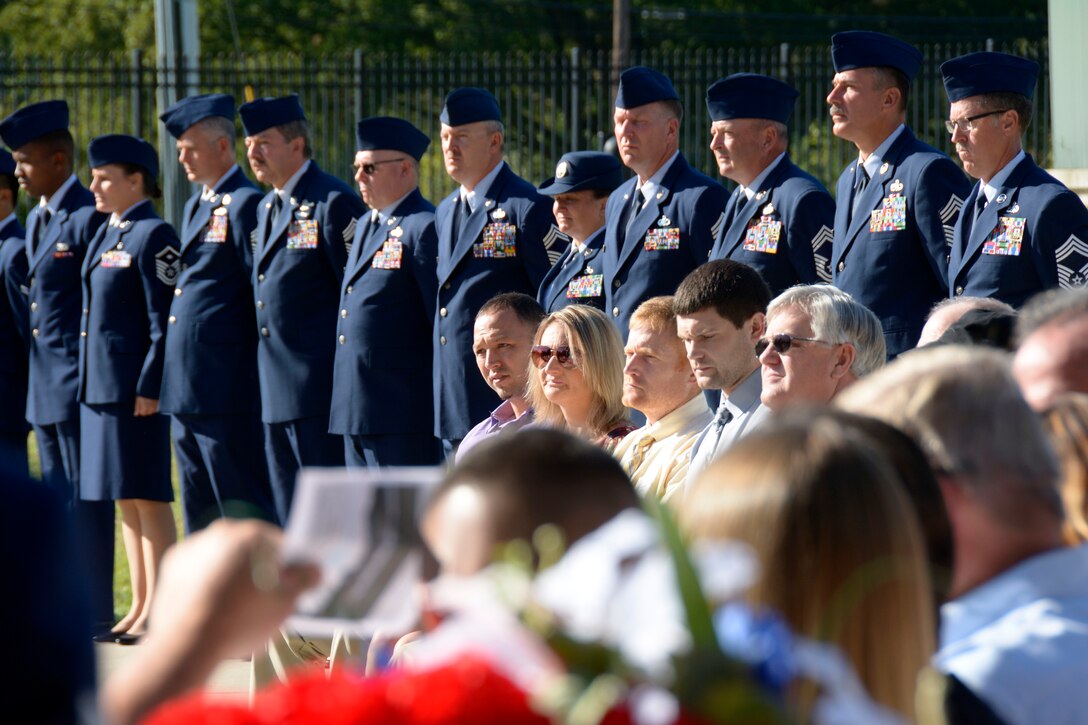 U.S. Air Force Airmen from the 145th Airlift Wing stand at attention while the names of members who have passed the previous year are memorialized in front of family and friends at the North Carolina Air National Guard (NCANG) Base, Charlotte Douglas Int’l. Airport, Oct. 2, 2016. Additional names of members who’ve passed are memorialized each year as a lasting tribute to those individuals who have helped establish the proud tradition upon which the NCANG is built. (U.S. Air National Guard photo by Staff Sgt. Laura Montgomery)