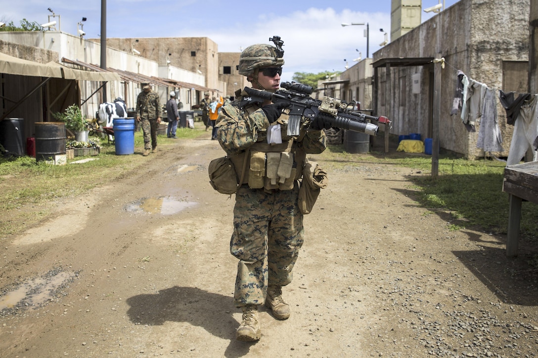 Marine Corps Lance Cpl. Justin Rumphrey patrols a simulated village during Island Viper at Bellows Air Force Station, Hawaii, Sept. 29, 2016.The three-week training event focuses on sharpening the infantry skills of individuals, teams and squads. Marine Corps photo by Lance Cpl. Jesus Sepulveda Torres

