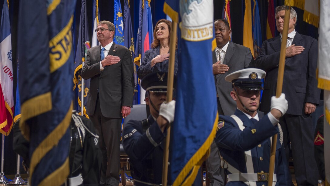 Defense Secretary Ash Carter shows respect during the opening presentation for the Department of Defense Disability Awards ceremony at the Pentagon, Oct. 4, 2016. DoD photo by Air Force Tech. Sgt. Brigitte N. Brantley