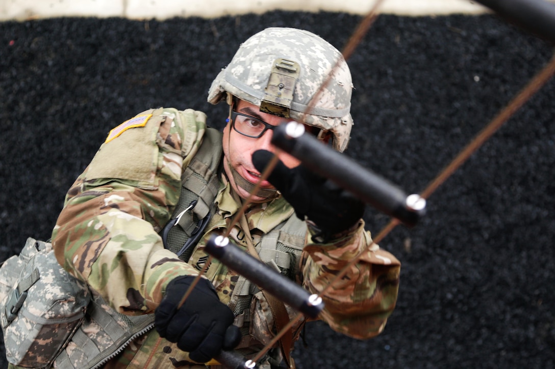 Army Sgt. 1st. Class Alexander Garcia climbs a ladder while participating in the tower event during the Army's 2016 Best Warrior Competition at Fort A.P. Hill, Va., Sept. 27, 2016. Garcia is assigned to U.S. Army Materiel Command. Army photo by Pfc. Fransico Isreal