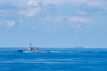 SOUTH CHINA SEA (Oct. 3, 2016) The guided-missile destroyers USS Spruance (DDG 111) and USS Decatur (DDG 73) steam alongside amphibious assault ship USS Bonhomme Richard (LHD 6) as part of interoperability drills between the Pacific Surface Action Group (PAG SAG) and Bonhomme Richard Expeditionary Strike Group (ESG).  