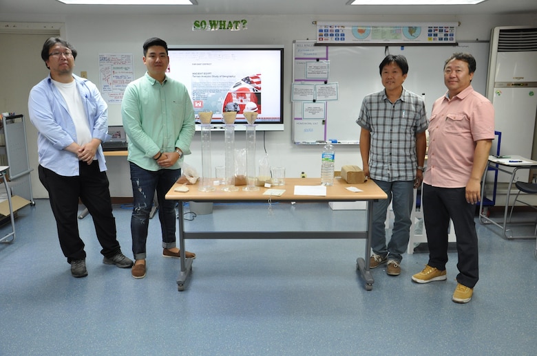 Yi, Song-pok, Steve Kim, Kwon, Ku-hyon and Choe, Ye-kwon, all of the Far East District's geotechnical section provided students of Seoul American Elementary School with a lesson in terrain analysis and soil permeability Sept. 30. Activities such as these are part of the district's science, technology, engineering and math (STEM) initiative throughout all DoDDS schools in the Republic of Korea.