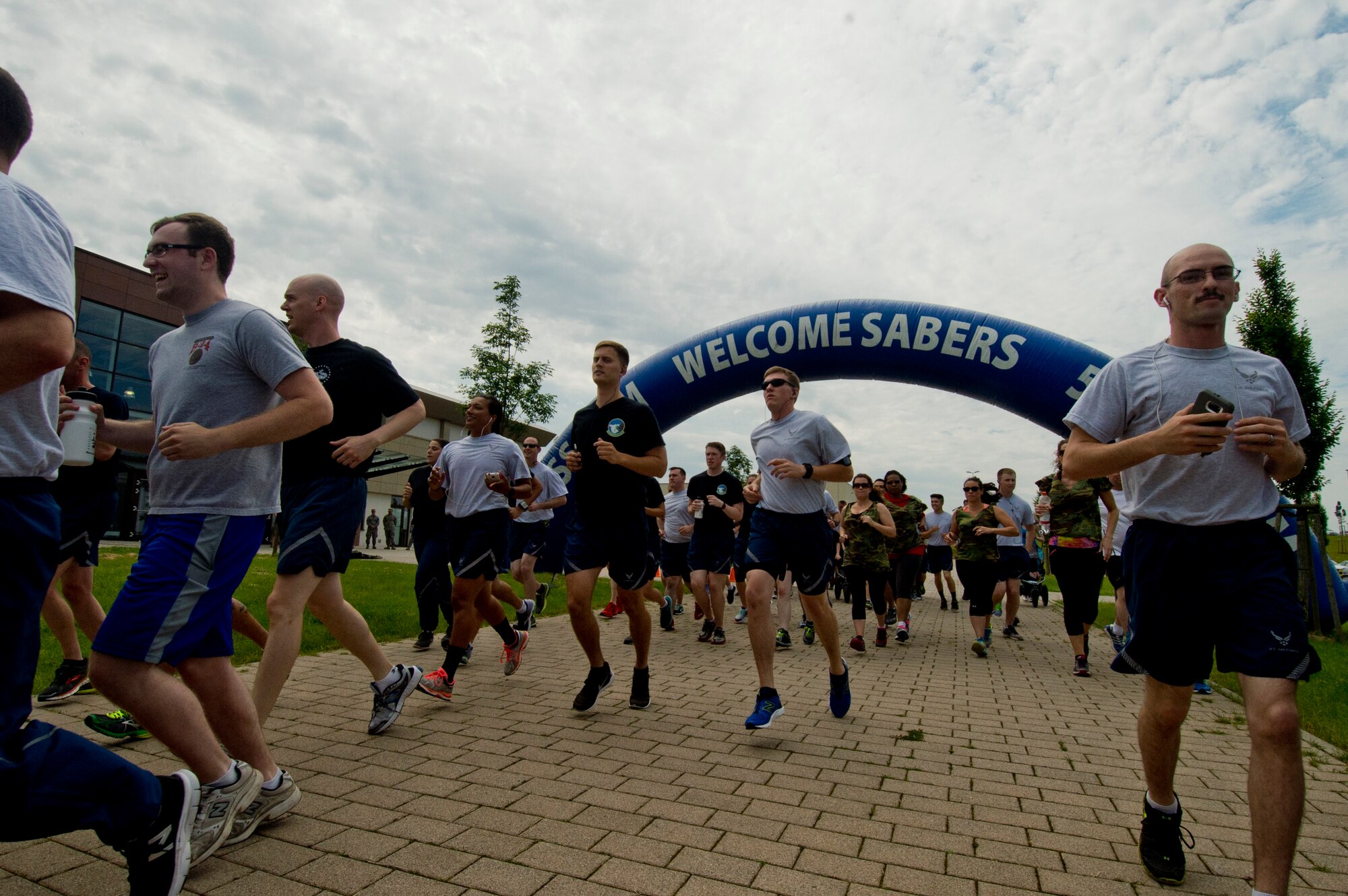 Spangdahlem Air Base Airmen run in a 5K during the "Are You the Best You Can Be?" resiliency day event at the Eifel Powerhaus fitness center at Spangdahlem Air Base, Germany, June 24, 2016. The 52nd Aerospace Medicine Squadron's Health Promotions flight will be sponsoring a "Triple-Ribbon" 5K in honor of Breast Cancer Awareness Month, Domestic Violence Awareness Month and Prescription Drug Misuse Awareness Month outside the fitness center Oct. 7, 2016.  (U.S. Air Force photo by Staff Sgt. Joe W. McFadden/Released)

