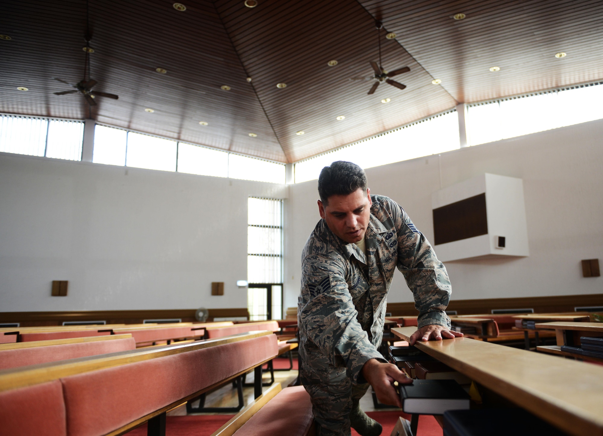 Staff Sgt. Johannes Cilliers, 86th Airlift Wing chaplain assistant, sets up a chapel for a religious service at Ramstein Air Base, Germany, Sept. 30, 2016. The Ramstein chapel community provides religious and counseling services to all Airmen, whether they are religious or not. (U.S. Air Force photo/ Airman 1st Class Joshua Magbanua)