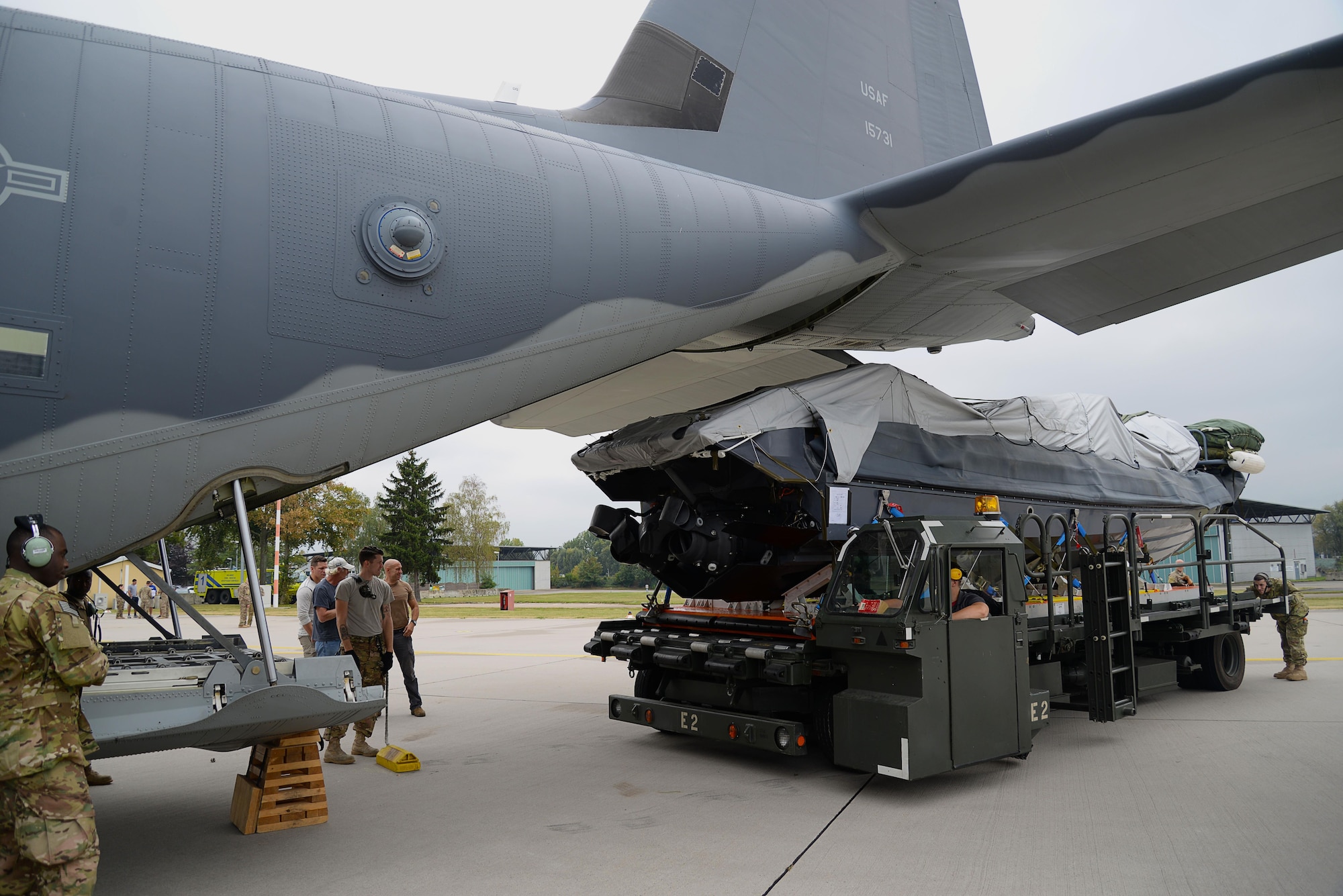 Loadmasters and crew chiefs from the 67th Special Operations Squadron guide a Rigid Inflatable Boat as it’s loaded onto an MC-130J Commando II in preparation for a Maritime Craft Aerial Delivery drop Sept. 26, 2016, at Stuttgart Air Base, Germany. Two of three MC-130J Commando IIs from the 67th SOS were loaded for MCADS drops in participation with the 2016 Night Hawk exercise. (U.S. Air Force photo by Senior Airman Justine Rho)