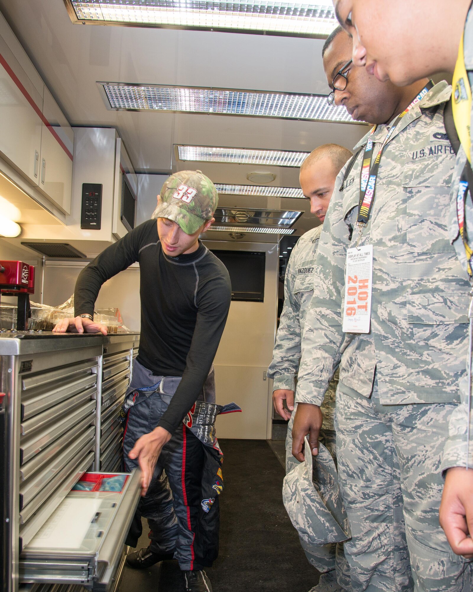 Brandon Jones, driver of the No. 33 Nexteer Chevy Camaro, gives Team Dover Airmen a tour of his racecar trailer Oct. 1, 2016 at Dover International Speedway, Del. The tour was given as part of the Troops to Track program which allows service members, veterans and military families the opportunity to meet NASCAR drivers and learn more about each other. (U.S. Air Force photo by Mauricio Campino)