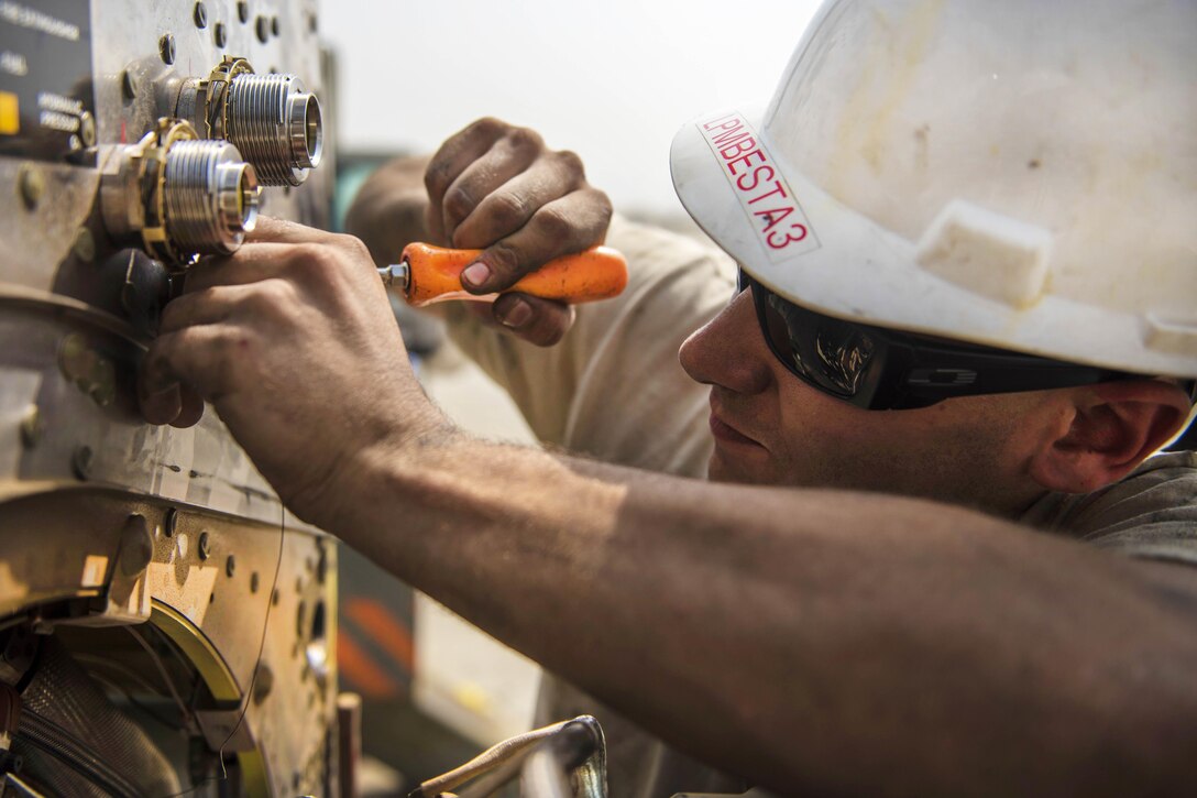 Air Force Senior Airman Thomas Budd safety wires a fire loop on a C-130J Super Hercules aircraft at Bagram Airfield, Afghanistan, Oct. 1, 2016. Budd is an electrician assigned to the 455th Expeditionary Aircraft Maintenance Squadron. The fire overheat protection system lets the aircraft crew know if the engine is at risk to catch fire. Air Force photo by Senior Airman Justyn M. Freeman