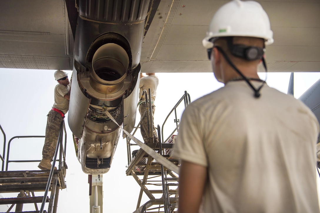 Air Force Senior Airmen Thomas Budd, left, and Colbey Cox, center, install a new C-130J Super Hercules aircraft engine at Bagram Airfield, Afghanistan, Oct. 1, 2016. Budd and Cox are electricians assigned to the 455th Expeditionary Aircraft Maintenance Squadron. The maintenance squadron airmen are responsible for repairing and maintaining military aircraft on Bagram, as well as performing preventative maintenance inspections. Air Force photo by Senior Airman Justyn M. Freeman