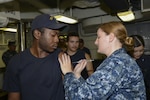 Petty Officer 3rd Class Brista Stair administers flu vaccinations to Sailors aboard amphibious assault ship USS Iwo Jima.