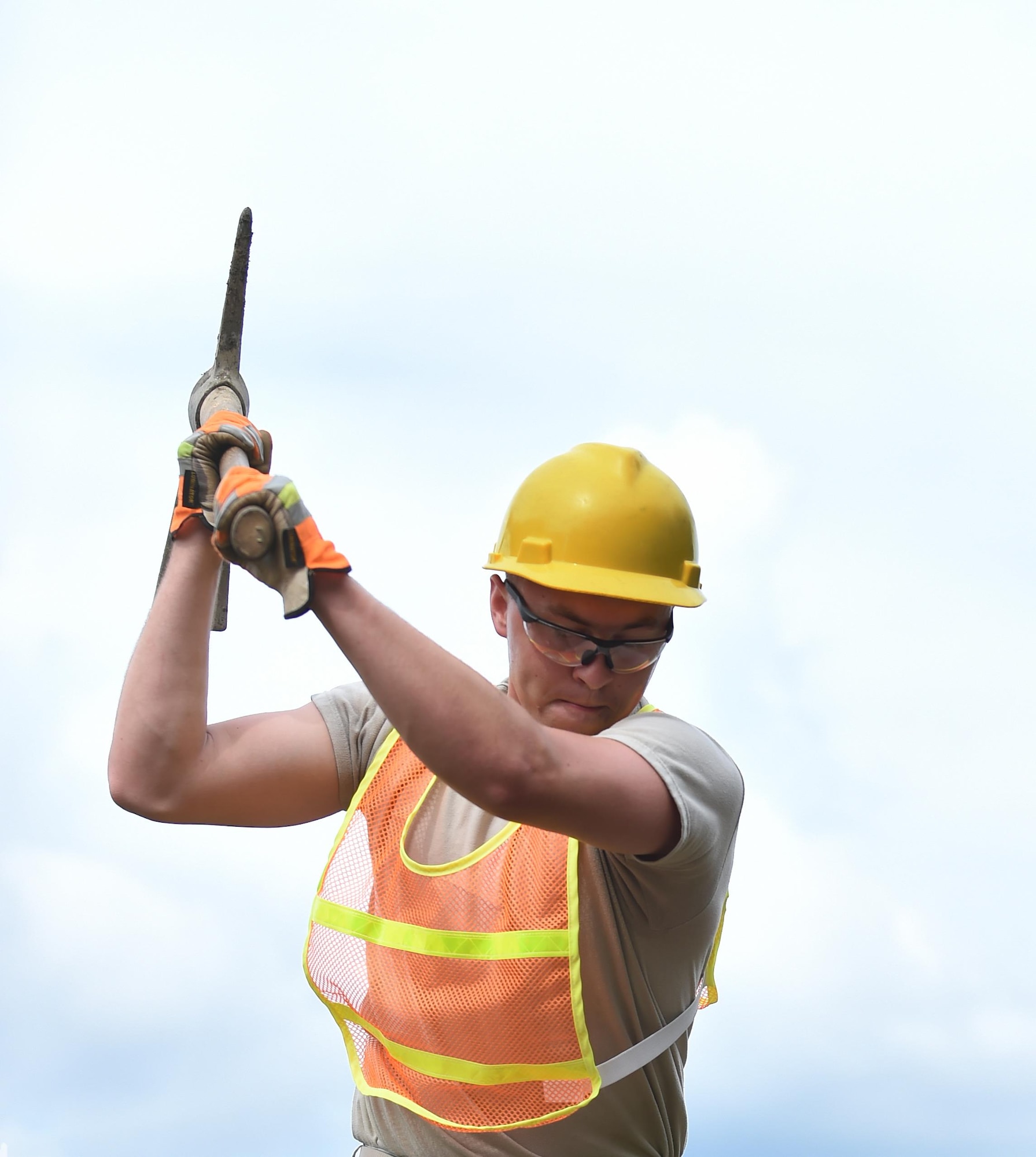U.S. Army Spc. Riley Stonemenger, 757th Expeditionary Rail Command railway planning and advisory team member, uses a pick to loosen rotted rail ties during a training course at Joint Base Langley-Eustis, Va., Oct. 4, 2016. Rail advisory missions can range from advising military units on transporting equipment for the U.S. Air Force, humanitarian supplies for the Army, fuel for the U.S. Marines and a variety of other supplies or equipment for any interested military party. (U.S. Air Force photo by Staff Sgt. Natasha Stannard)
