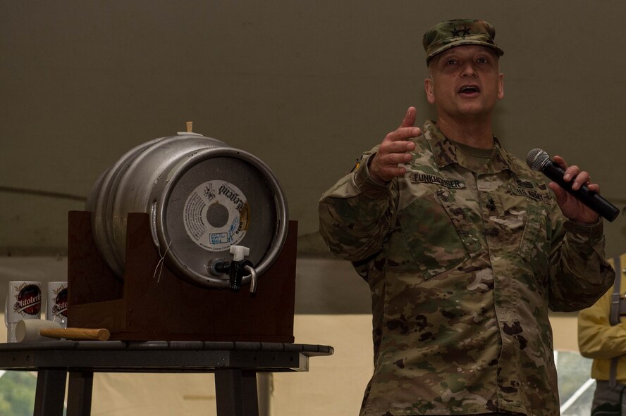 U.S. Army Gen. Anthony Funkhouser, Center for Initial Military Training commander, speaks to the attendees of Oktoberfest celebration at Joint Base Langley-Eustis, Va., Sept. 30, 2016. The event included The Happy Dutchman band who perform German polka music. (U.S. Air Force photo by Airman 1st Class Derek Seifert) 