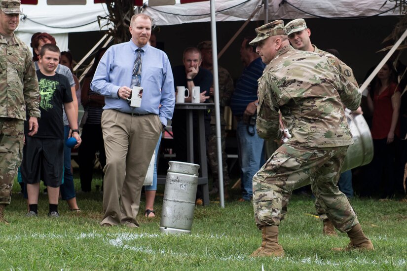 U.S. Army Gen. Anthony Funkhouser, Center for Initial Military Training commander, throws a keg during an Oktoberfest celebration at Joint Base Langley-Eustis, Va., Sept. 30, 2016. The festival originally only featured a horse race, but over the following 200 years beer stalls, merry-go-rounds and other amusements were added. (U.S. Air Force photo by Airman 1st Class Derek Seifert)