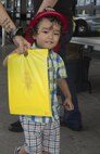 A little boy receives handouts during the Emergency Awareness Day at the commissary on Camp Foster, Okinawa, September 27, 2016. Emergency Awareness Day intends to increase the knowledge of the community by alerting people and providing them with a better understanding of the actions that need to be taken in the case of emergency. (U.S. Marine Corps photo by MCIPAC Combat Camera PFC. Damion Hatch JR/Released)