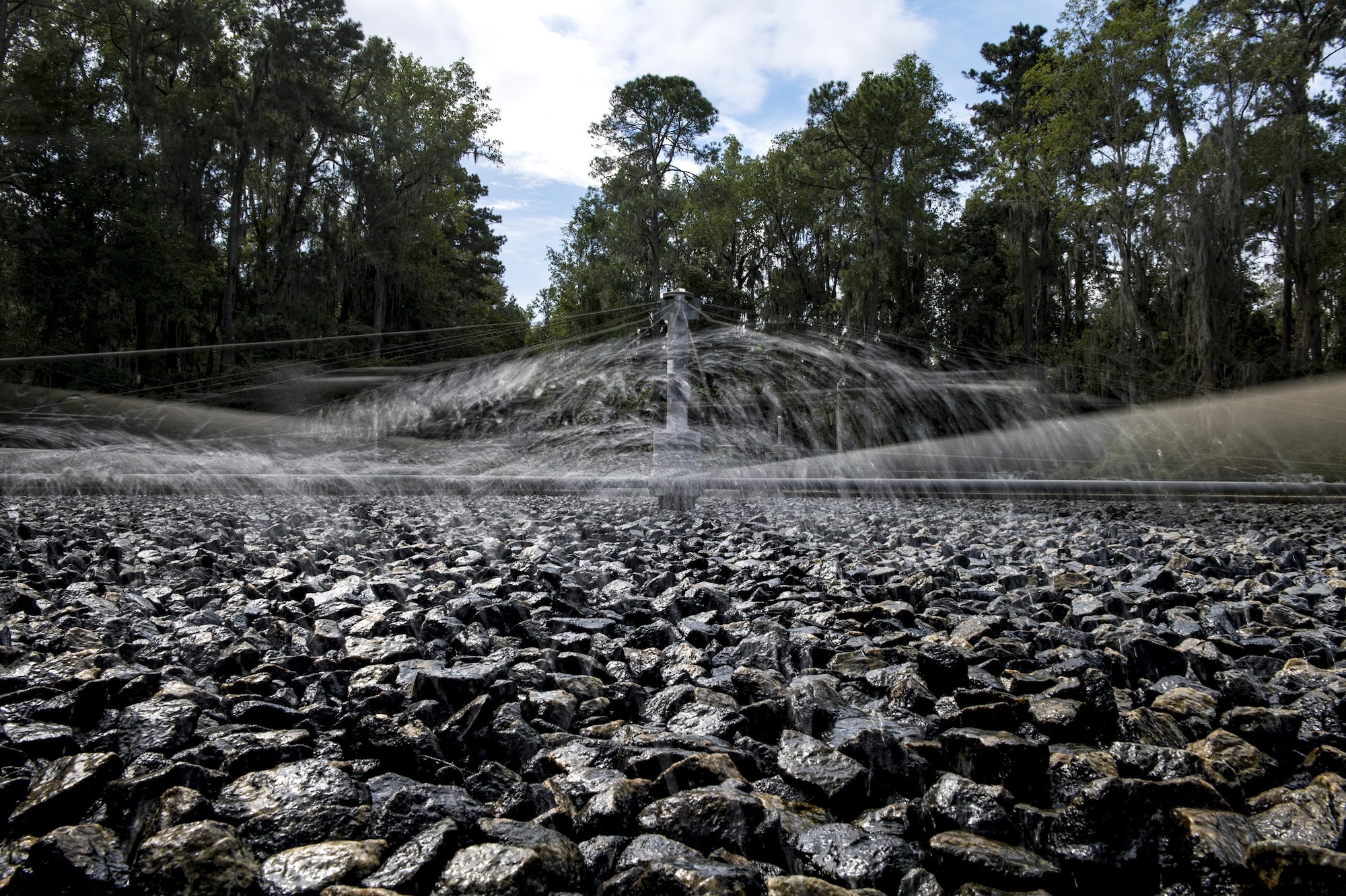 A trickling filter rotates during a ceremony, Oct. 3, 2016, in Valdosta, Ga. The trickling filter processes and treats wastewater that comes into the Water and Wastewater Treatment Plant. (U.S. Air Force photo by  Airman 1st Class Janiqua P. Robinson)