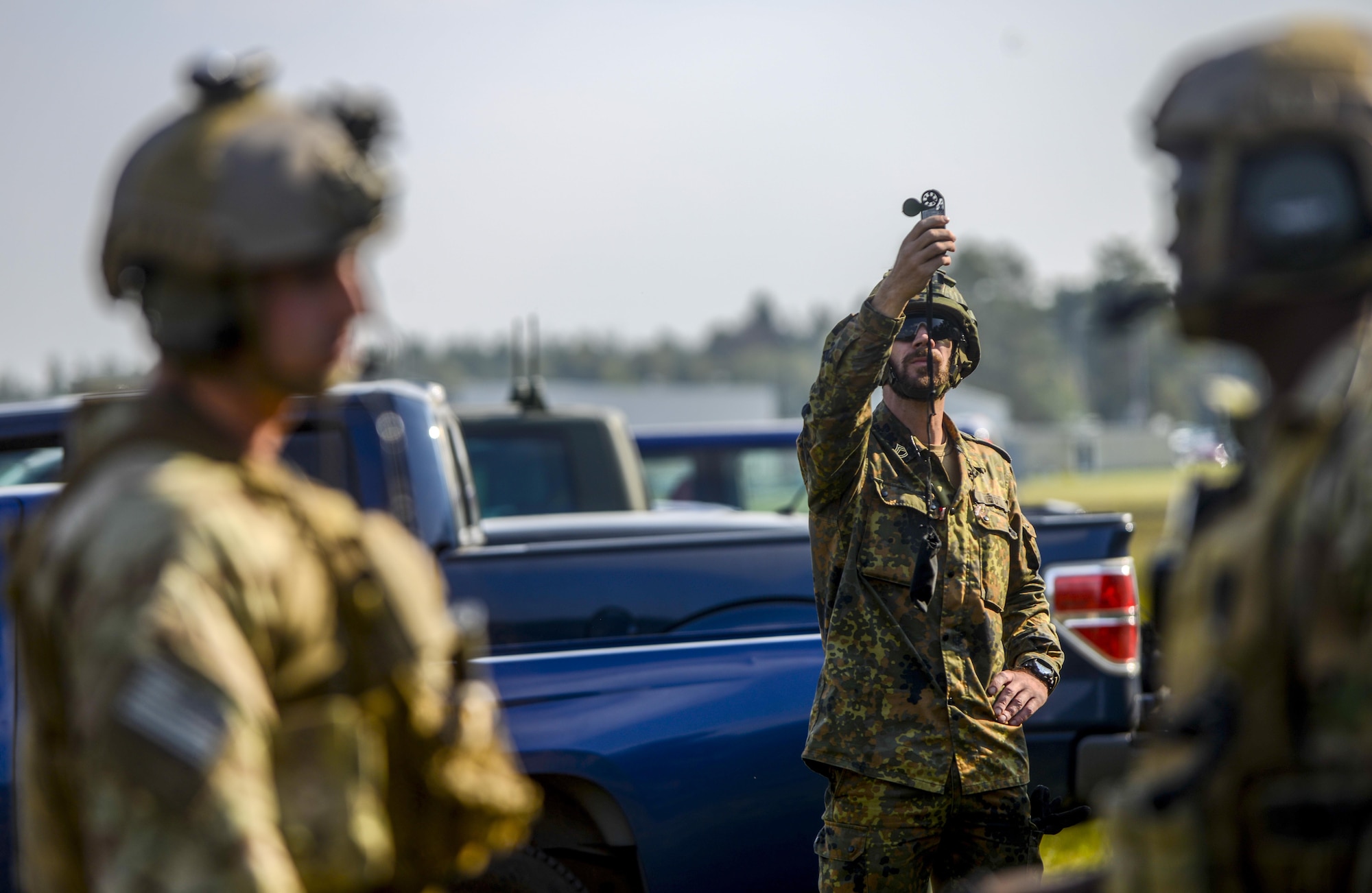 German army Staff Sgt. Sascha Wendt, Centre of Geoinformation of the Bundeswehr weather observer, uses a kestrel meter to measure wind speeds during exercise Cadre Focus 16.2 in Grafenwoehr, Germany, Sept. 27, 2016. Cadre Focus 16.2 marked the first time Airmen from the 7th Weather Squadron and 7th Expeditionary Weather Squadron invited NATO partners to Cadre Focus, which allows weather forecasters to train on basic U.S. Army skills such as land navigation, reaction to fire and calling in a medical evacuation. (U.S. Air Force photo by Staff Sgt. Timothy Moore)