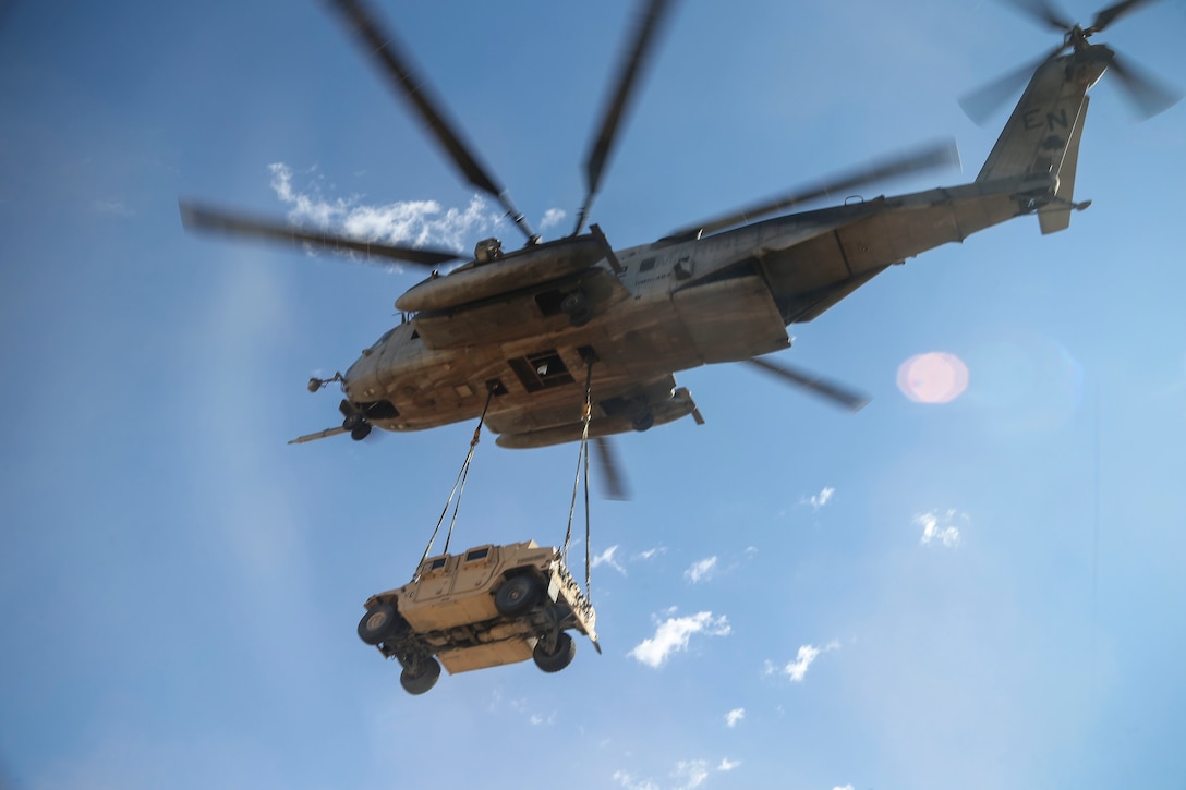 A Marine Corps CH-53E Super Stallion helicopter lifts a Humvee during a slingload tactics exercise at Auxiliary Airfield II, Yuma, Ariz., Sept. 30, 2016. Marine Corps photo by Staff Sgt. Artur Shvartsberg