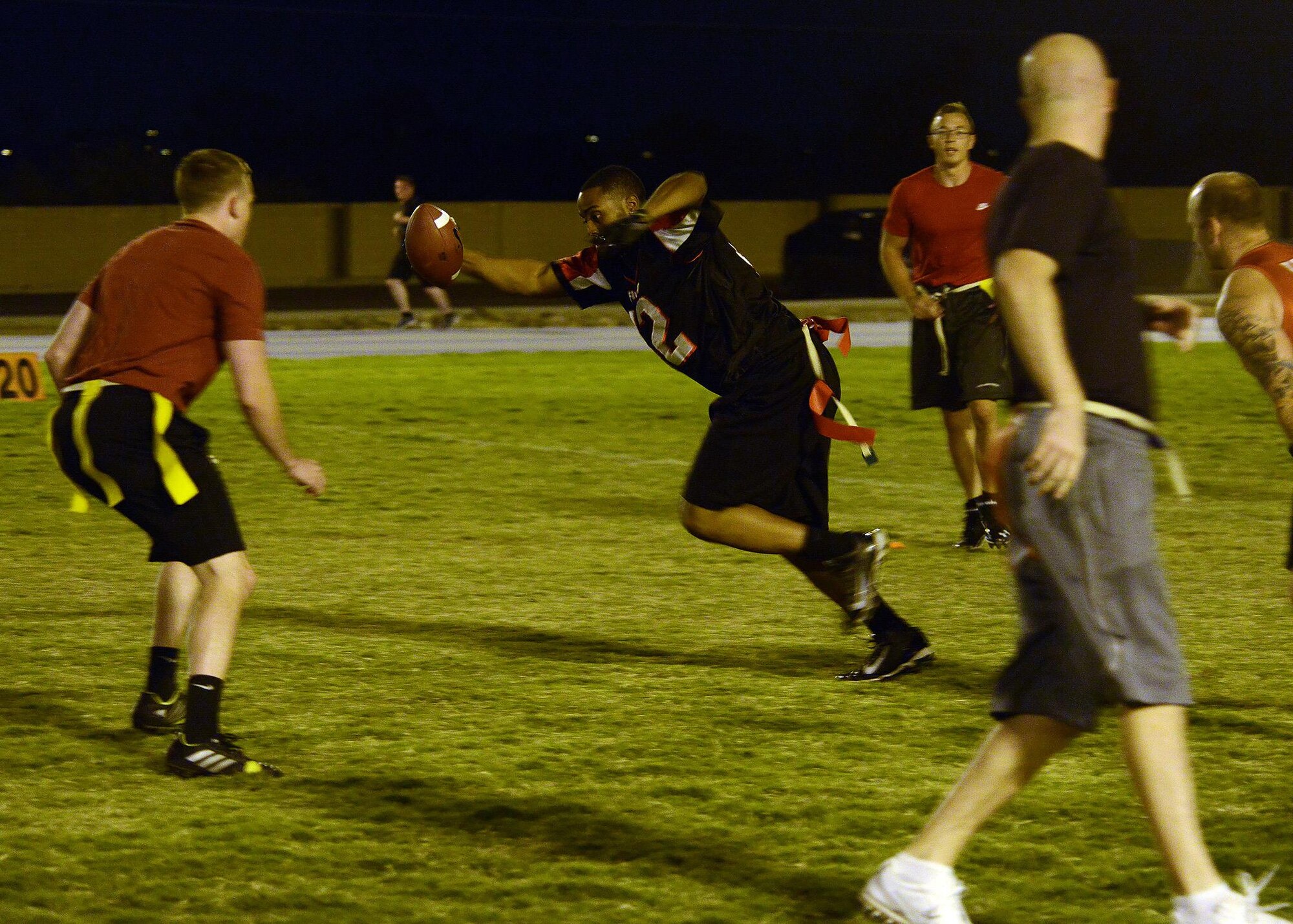 Markeith Wimbush, 56th Security Forces Squadron, runs towards the first down during an in intramural flag football game against 56th Equipment Maintenance Squadron/AMMO Sept. 16, 2016 at Luke Air Force Base, Ariz. SFS defeated EMS/AMMO 7-6. (U.S. Air Force photo by Senior Airman Devante Williams)