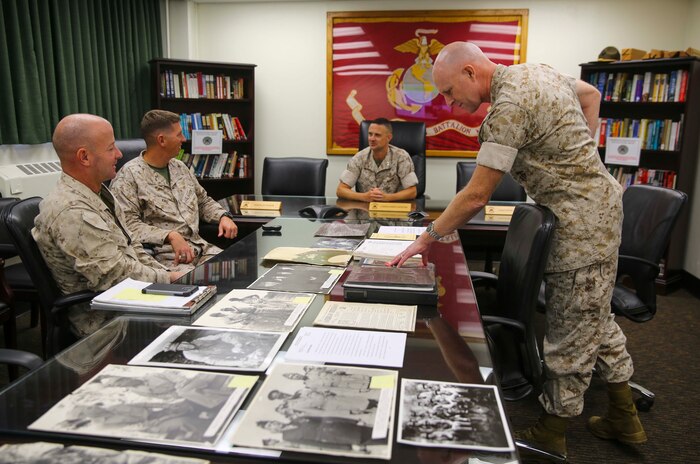 Colonel David W. Edson (right), Assistant Chief of Staff G-1, Marine Forces Reserve, looks through photos of his grandfather, Maj. Gen. Merritt A. Edson, during his visit to Marine Corps Base Camp Pendleton, Calif., Sept. 28. Edson Range is named after Edson’s grandfather, Maj. Gen. Merritt A. Edson.