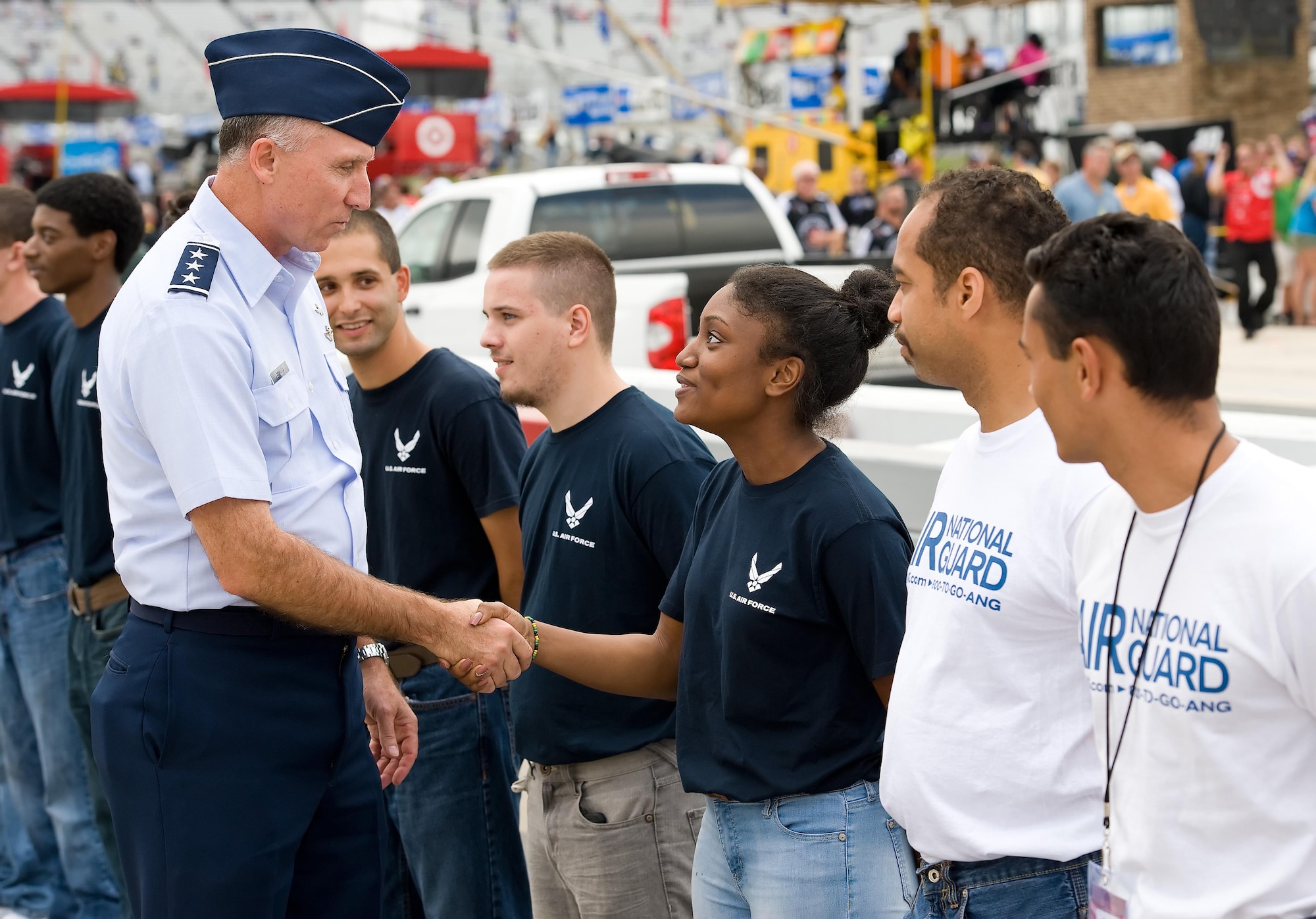 Lt. Gen. Bill Bender, Chief Information Dominance and Chief Information Officer, Office of the Secretary of the Air Force, the Pentagon, Washington, D.C., meets with the newest U.S. Air Force recruits prior to taking the oath of enlistment during pre-race ceremonies during the Citizen Soldier 400 NASCAR Sprint Cup Series race Oct. 2, 2016, at Dover International Speedway, Dover, Del. Bender, along with Maj. Gen. Frank Vavala, Delaware National Guard adjutant general, administered the oath to enlistees that will be entering active duty or the Air National Guard. (U.S. Air Force photo by Roland Balik)