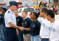 Lt. Gen. Bill Bender, Chief Information Dominance and Chief Information Officer, Office of the Secretary of the Air Force, the Pentagon, Washington, D.C., meets with the newest U.S. Air Force recruits prior to taking the oath of enlistment during pre-race ceremonies during the Citizen Soldier 400 NASCAR Sprint Cup Series race Oct. 2, 2016, at Dover International Speedway, Dover, Del. Bender, along with Maj. Gen. Frank Vavala, Delaware National Guard adjutant general, administered the oath to enlistees that will be entering active duty or the Air National Guard. (U.S. Air Force photo by Roland Balik)