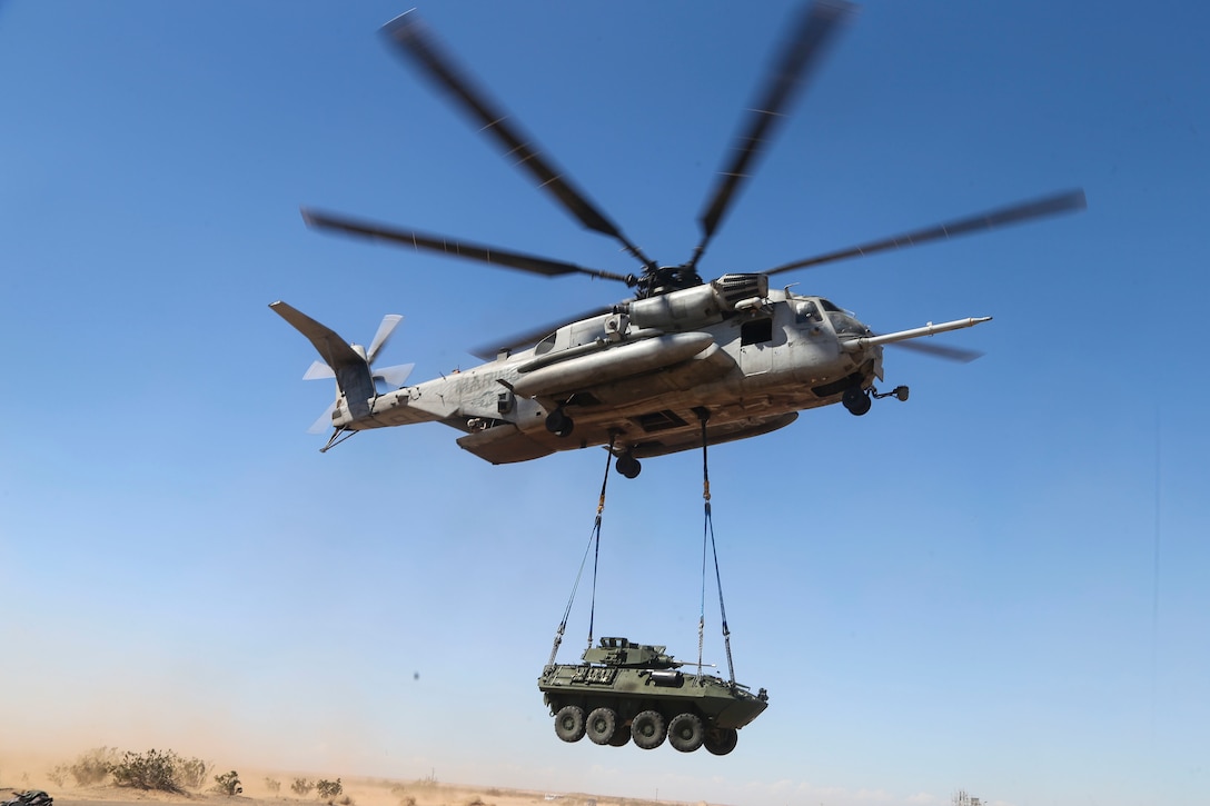 A Marine Corps CH-53E Super Stallion helicopter externally lifts a light armored vehicle during a slingload tactics exercise at Auxiliary Airfield II, Yuma, Ariz., Sept. 30, 2016. Marine Corps photo by Staff Sgt. Artur Shvartsberg