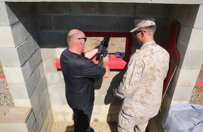 Sergeant Maj. Frank E. Pulley (Ret.) fires an M16-A4 Service Rifle during his visit to Marine Corps Base Camp Pendleton, Calif., Sept. 28. Pulley visited with Dakota Meyer, Medal of Honor recipient, who received a tour of Edson Range and spoke with recruits completing the Crucible.
