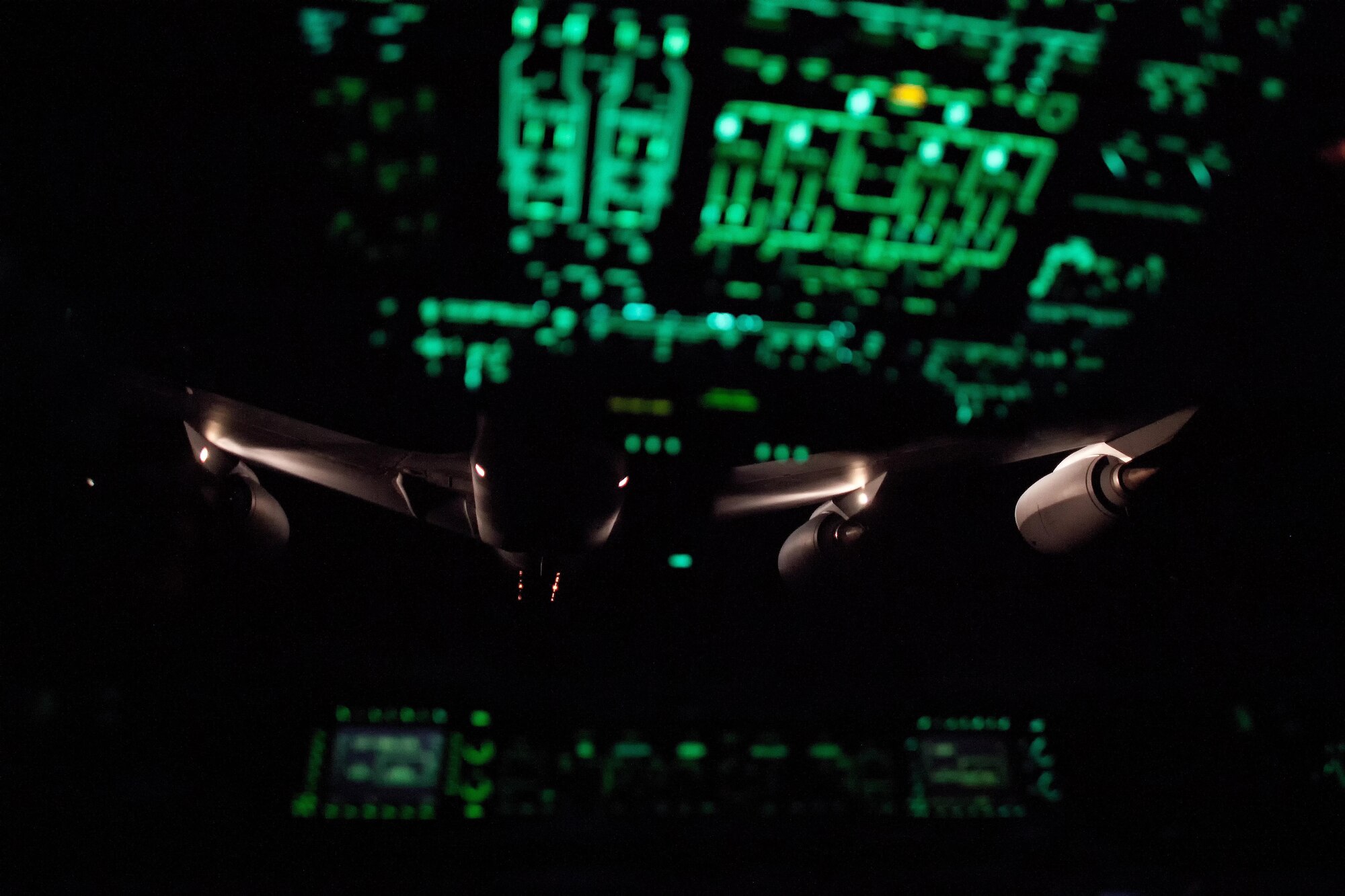Pilots from the 3d Airlift Squadron, Dover Air Force Base, Del., slowly fly their C-17A Globemaster III into position during an air refueling training mission Sept. 29, 2016. On this training mission, NASCAR orientation flight participants took turns observing air refueling operations by a KC-135R Stratotanker from the 459th Air Refueling Wing, Joint Base Andrews, Md. (U.S. Air Force photo by Roland Balik)