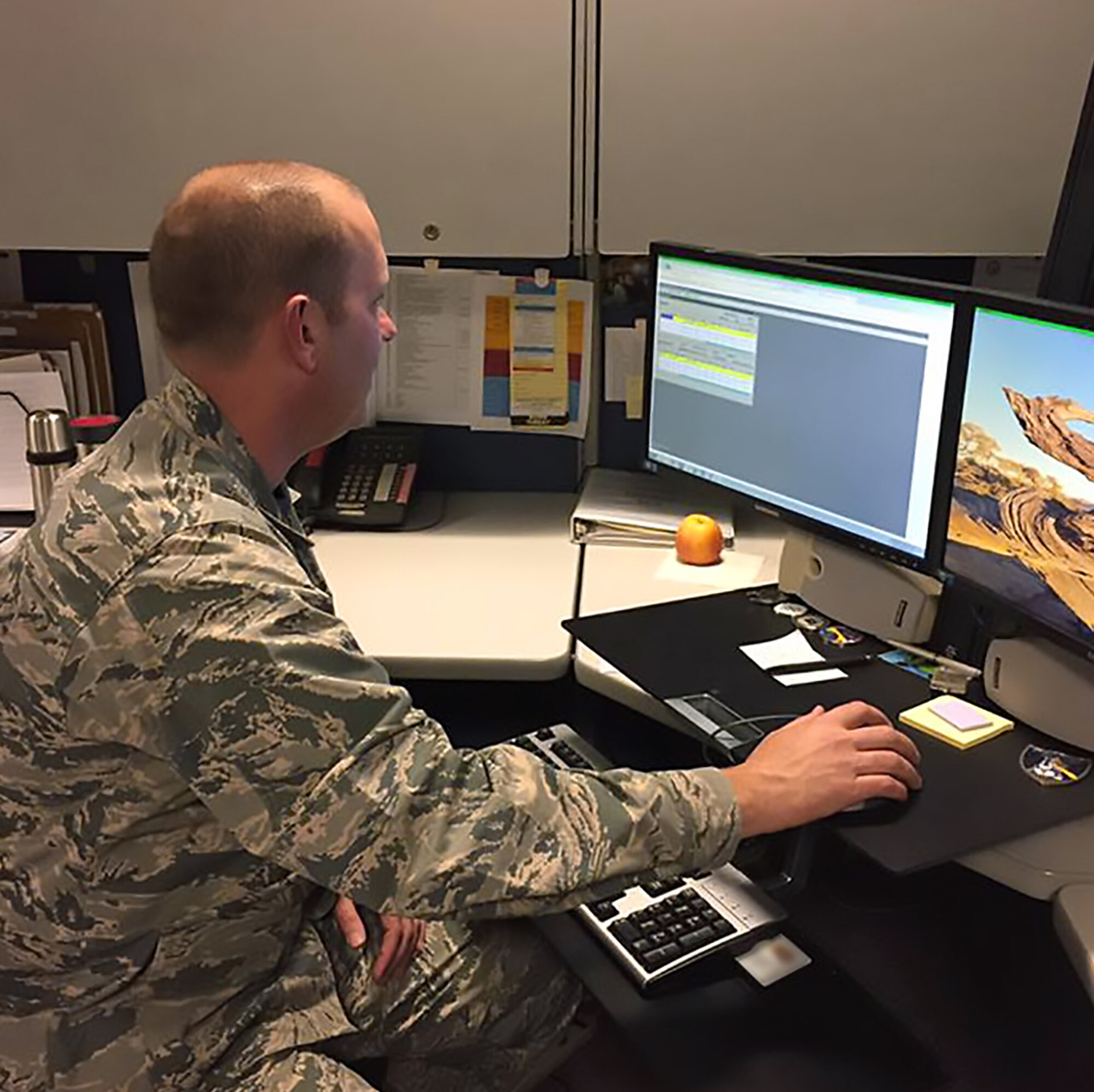 PETERSON AIR FORCE BASE, Colo. – Col. Doug Schiess, 21st Space Wing commander, helps the 21st Comptroller Squadron complete their end-of-year closeout at Peterson Air Force Base, Colo., Sept. 30, 2016. As the clock counted down to midnight, 21st CPTS’ main duties were to fully execute congressional appropriated funds to make sure Peterson AFB effectively used taxpayer dollars, and the budgets were up-to-date and balanced. (Courtesy Photo)