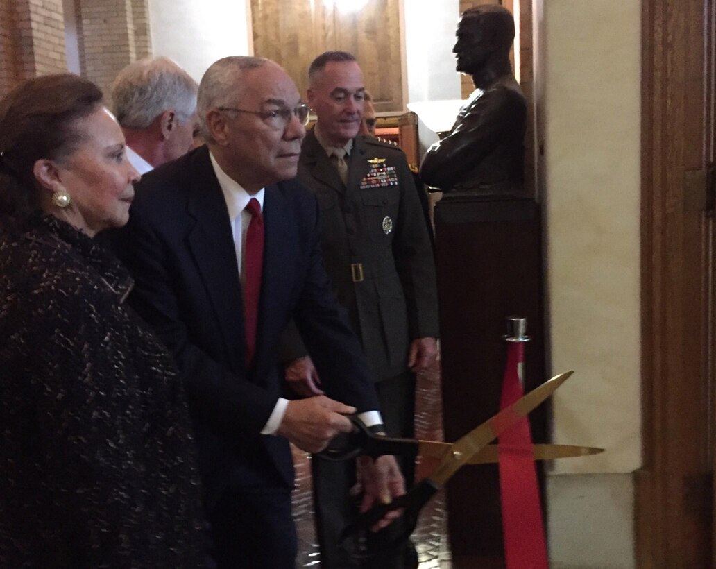 Retired Army Gen. Colin L Powell and his wife, Alma, cut the ribbon opening Powell Hall at the National War College on Fort Lesley J. McNair in Washington, D.C., as Marine Corps Gen. Joe Dunford, the chairman of the Joint Chiefs of Staff, looks on, Sept. 29, 2016. DoD photo by Jim Garamone