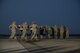 An Air Force carry team carries the remains of Maj. Troy Gilbert as the official party renders honors during a dignified transfer Oct. 3, 2016, at Dover Air Force Base, Del. Maj. Troy Gilbert, an F-16 Fighting Falcon pilot, was killed Nov. 27, 2006, in an F-16 crash 30 miles southwest of Balad Air Base, Iraq. Gilbert was the standardization and evaluation chief for the 332nd Expeditionary Operations Group and was deployed from the 309th Fighter Squadron from Luke Air Force Base, Ariz. (U.S. Air Force Photo by Senior Airman Aaron J. Jenne)