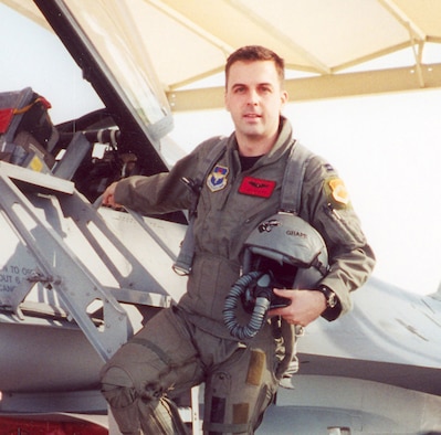 Maj. Troy Gilbert stands on the ladder of an F-16 at Luke Air Force Base, Ariz. Gilbert, an F-16 Fighting Falcon pilot, was killed Nov. 27, 2006, in an F-16 crash 30 miles southwest of Balad Air Base, Iraq. Gilbert was the standardization and evaluation chief for the 332nd Expeditionary Operations Group and was deployed from the 309th Fighter Squadron from Luke Air Force Base, Ariz. (Courtesy photo/Gilbert family)
