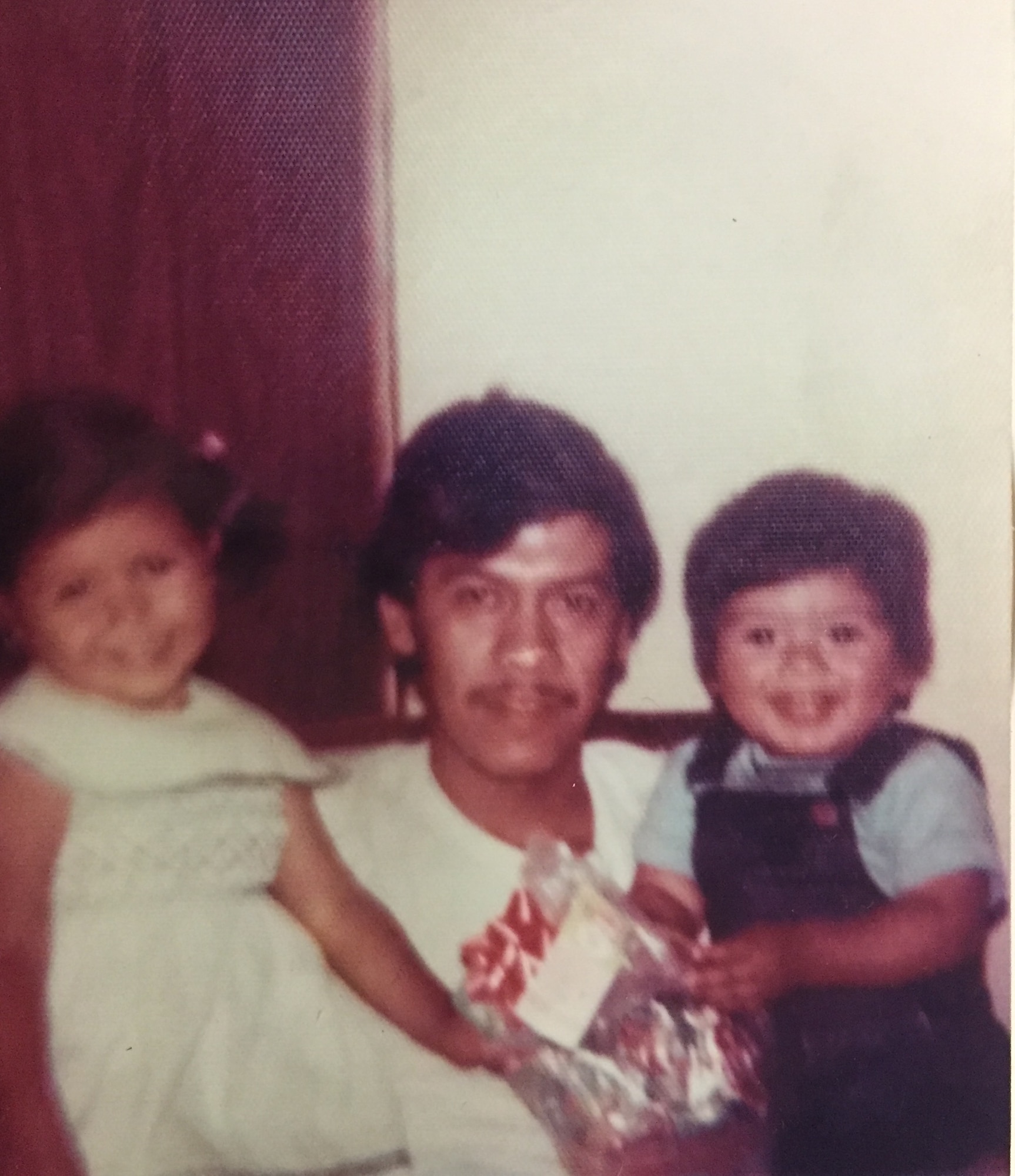 1 yr old in Mexico with Dad and Sister: Chief Master Sgt. Benjamin Miranda Jr. with his sister and father. 