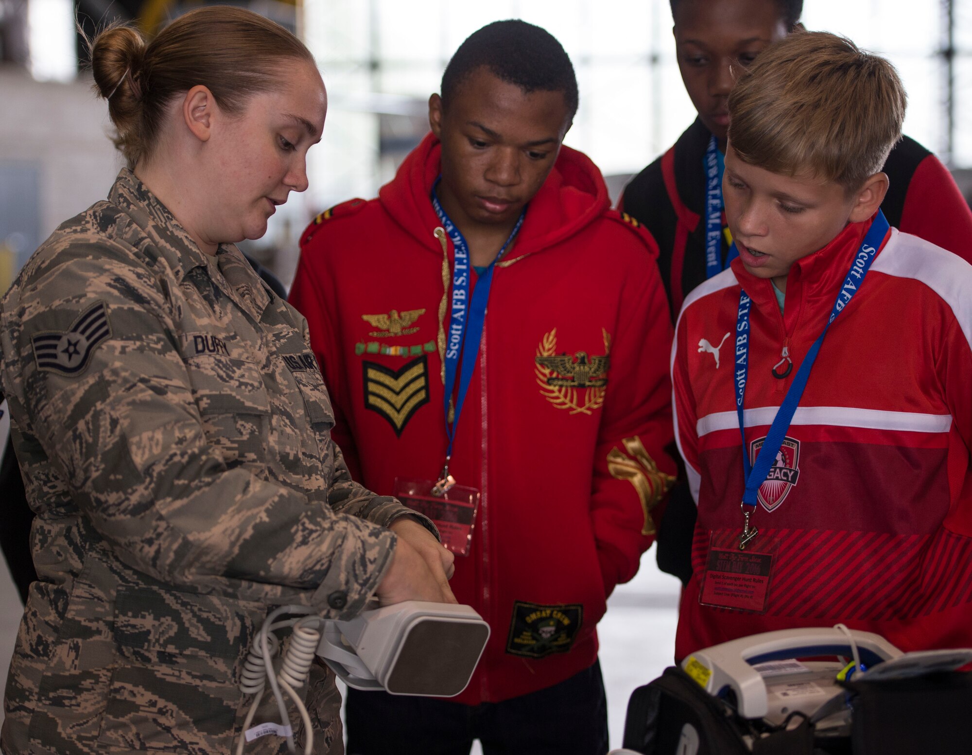 Staff Sgt. Chelsea Duffy, 375th Medical Support Squadron, demonstrates how to use medical equipment used as a biomedical equipment technician during Scott Air Force Base's Science, Technology, Engineering, and Math education event on Sept. 29, 2016.