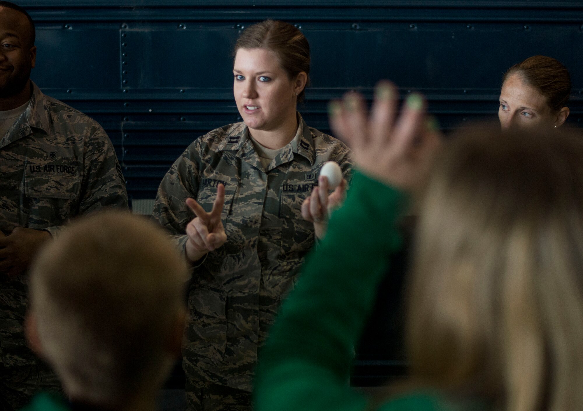 Capt. Jessica Barton, 375th Dental Squadron, asks for two volunteers during a demonstration about how soda deteriorates enamel in teeth on Scott Air Force Base, Ill., Sept. 29, 2016.  