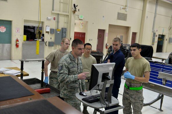 U.S. Air Force Tech. Sgt. Daniel Campanella, an Air Education and Training Command aerospace propulsion instructor with the 372nd Training Squadron Detachment 25, teaches torque sequence to students Sept. 27, 2016, at Eielson Air Force Base, Alaska. The material Campanella teaches helps prepare maintainers assigned here during by introducing them to the engine in the 18th Aggressor Squadron’s jets. (U.S. Air Force photo by Airman Isaac Johnson)