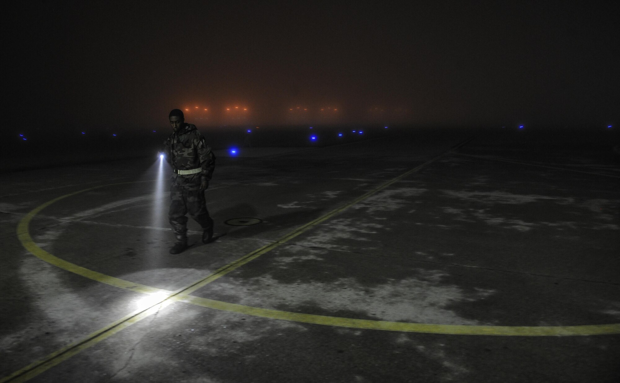 U.S. Air Force Senior Airman Jovan Bennett, 80th Fighter Squadron, 8th Aircraft Maintenance Unit crew chief, conducts a pre-flight inspection of the ground for rocks during Beverly Pack 17-1 at Kunsan Air Base, Republic of Korea, Oct. 4, 2016. The U.S. Air Force and Republic of Korea Air Force provide combat capabilities and training by performing exercises throughout the year to enhance communication and interoperability between military forces so they are prepared to fight as a combined force. (U.S. Air Force photo by Senior Airman Colville McFee/Released) 
