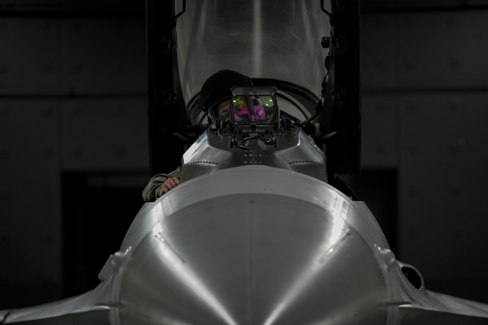 U.S. Air Force Capt. Jacob Houder, 162nd Wing National Guard pilot, conducts a pre-flight inspection while sitting in the cockpit of an F-16 Fighting Falcon during Beverly Pack 17-1 at Kunsan Air Base, Republic of Korea, Oct. 4, 2016. The U.S. Air Force and Republic of Korea Air Force provide combat capabilities and training by performing exercises throughout the year to enhance communication and interoperability between military forces so they are prepared to fight as a combined force. (U.S. Air Force photo by Senior Airman Colville McFee/Released) 