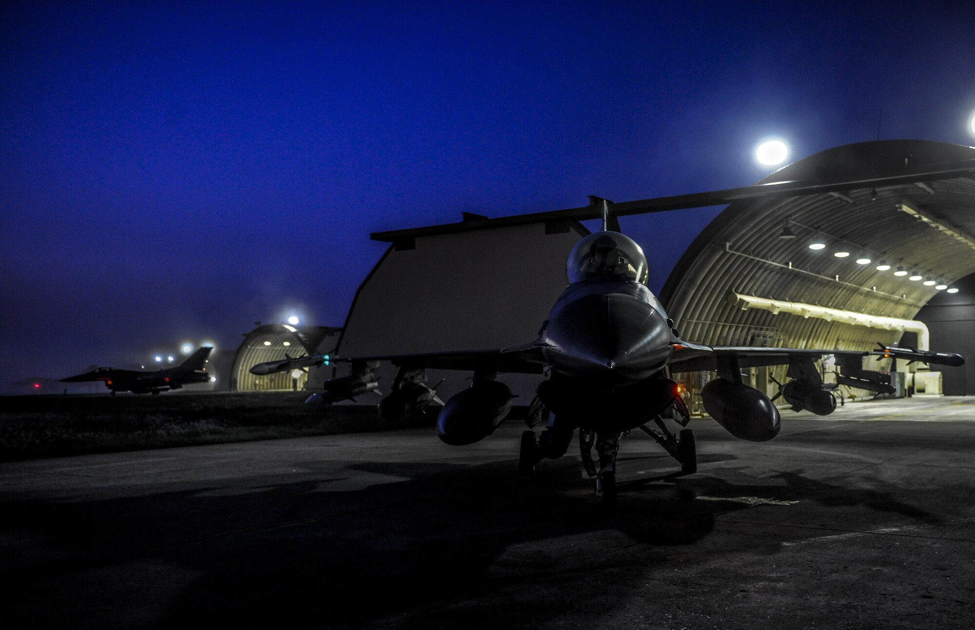 U.S. Air Force F-16 Fighting Falcons from the 8th Fighter Wing are parked outside of their hanger bays during Beverly Pack 17-1 at Kunsan Air Base, Republic of Korea, Oct. 4, 2016. The U.S. Air Force and Republic of Korea Air Force provide combat capabilities and training by performing exercises throughout the year to enhance communication and interoperability between military forces so they are prepared to fight as a combined force (U.S. Air Force photo by Senior Airman Colville McFee/Released) 