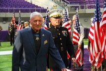 Major Andrew Nicholson, commanding officer of Marine Corps Recruiting Station Twin Cities, escorts Medal of Honor recipient Wesley Fox, a retired Marine Corps colonel, at the Twin Cities Medal of Honor Ceremony, Oct. 5. Fox received the Medal of Honor for Heroic actions during the Vietnam War. 