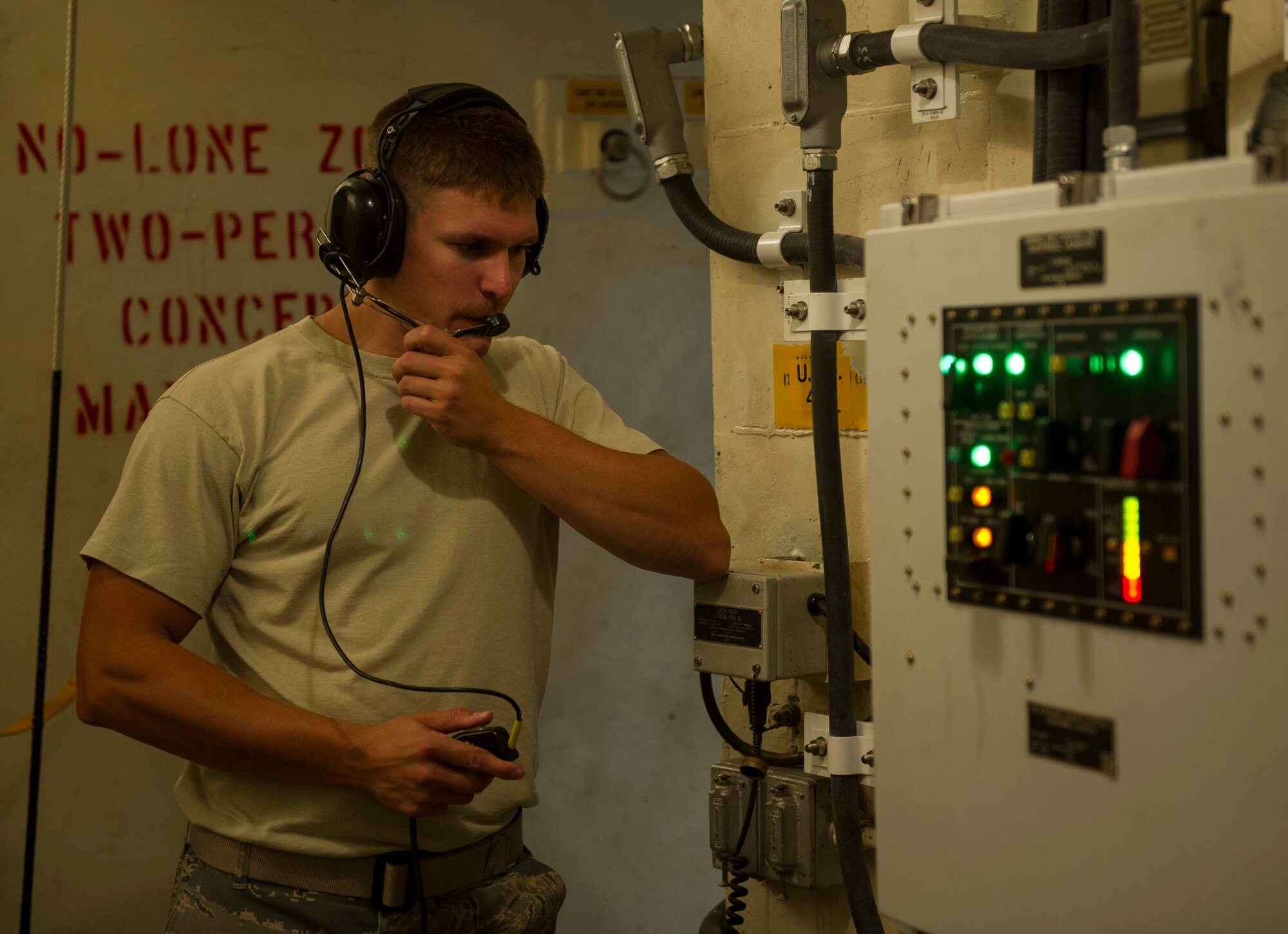 Staff Sgt. Shane Stilson, 91st Missile Maintenance Squadron periodic maintenance team chief, communicates with his above-ground team members at the A-09 launch facility in the missile complex, N.D., Sept. 7, 2016. The team works together from all around the facility to get the job done. (U.S. Air Force photo/Senior Airman Apryl Hall)