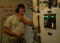 Staff Sgt. Shane Stilson, 91st Missile Maintenance Squadron periodic maintenance team chief, communicates with his above-ground team members at the A-09 launch facility in the missile complex, N.D., Sept. 7, 2016. The team works together from all around the facility to get the job done. (U.S. Air Force photo/Senior Airman Apryl Hall)