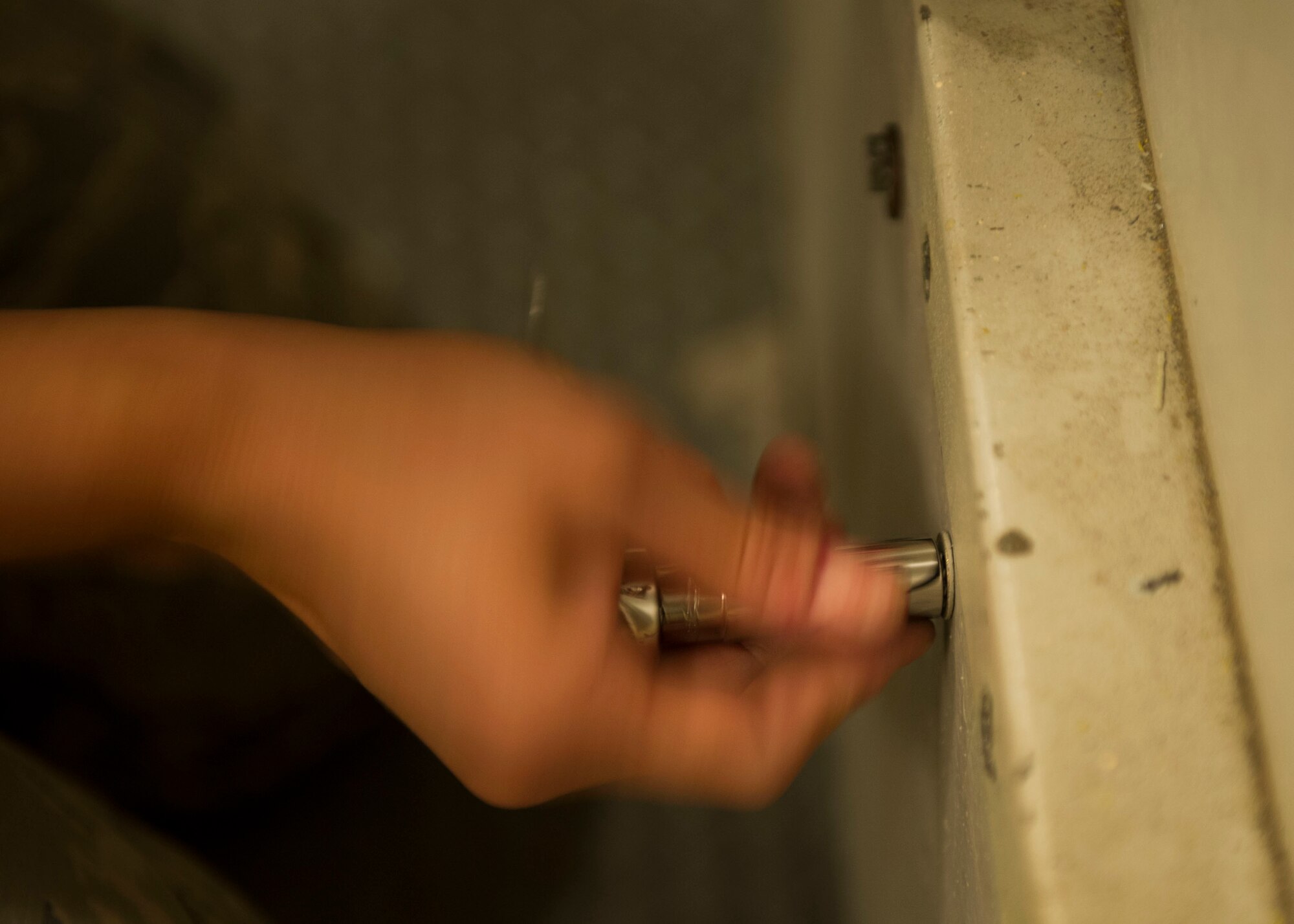 Airman 1st Class Ashleigh Gray, 91st Missile Maintenance Squadron periodic maintenance team technician, removes screws from a panel at the A-09 launch facility in the missile complex, N.D., Sept. 7, 2016. The 140 screws are removed in a particular sequence to keep them in precise order. (U.S. Air Force photo/Senior Airman Apryl Hall)